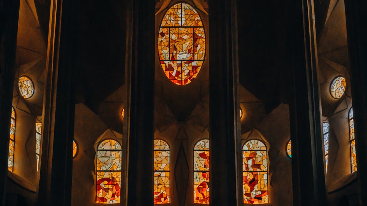Intricate stained glass windows inside Sagrada Familia, Barcelona.
